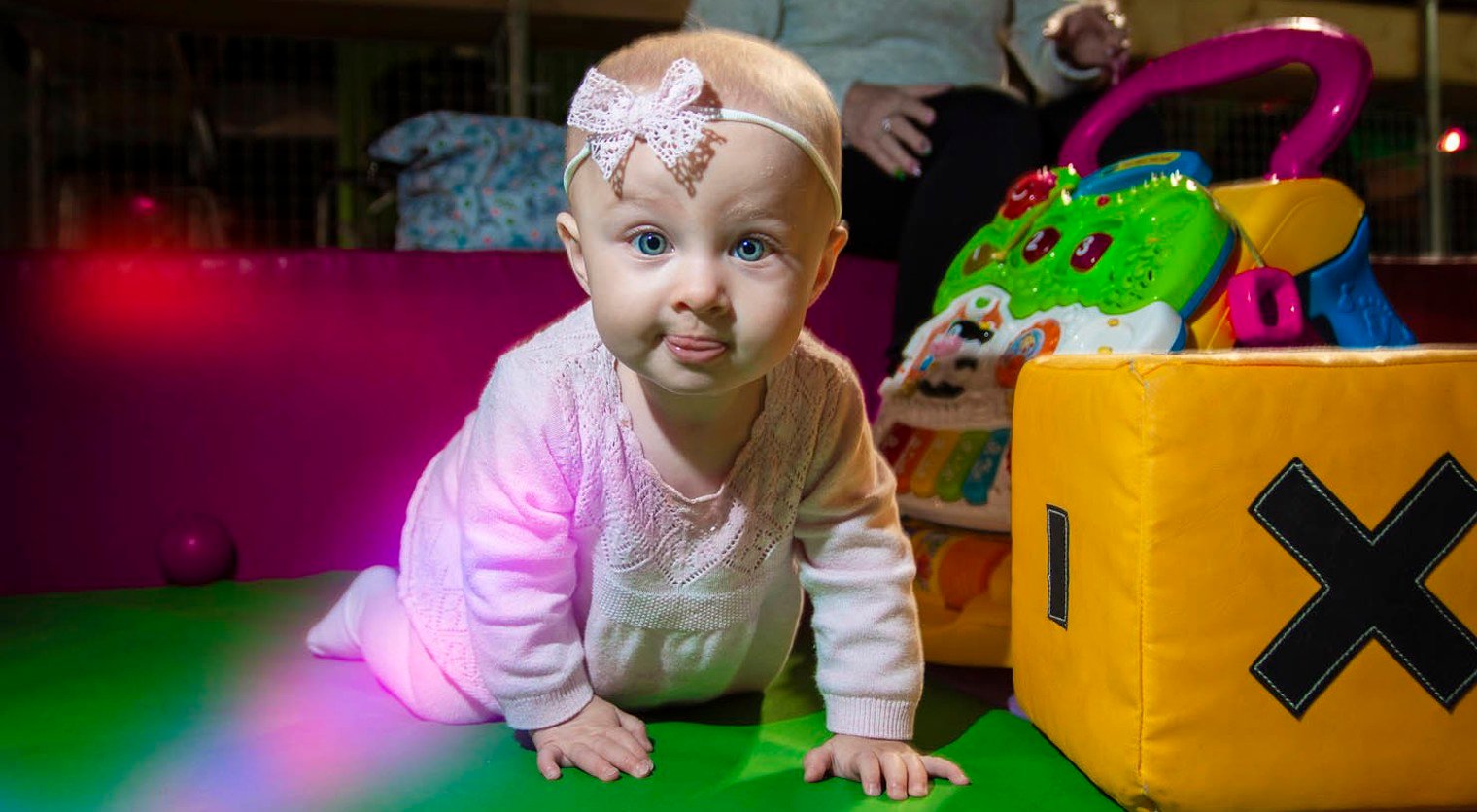 A crawling child playing in the Soft Play area at Flip Out UK