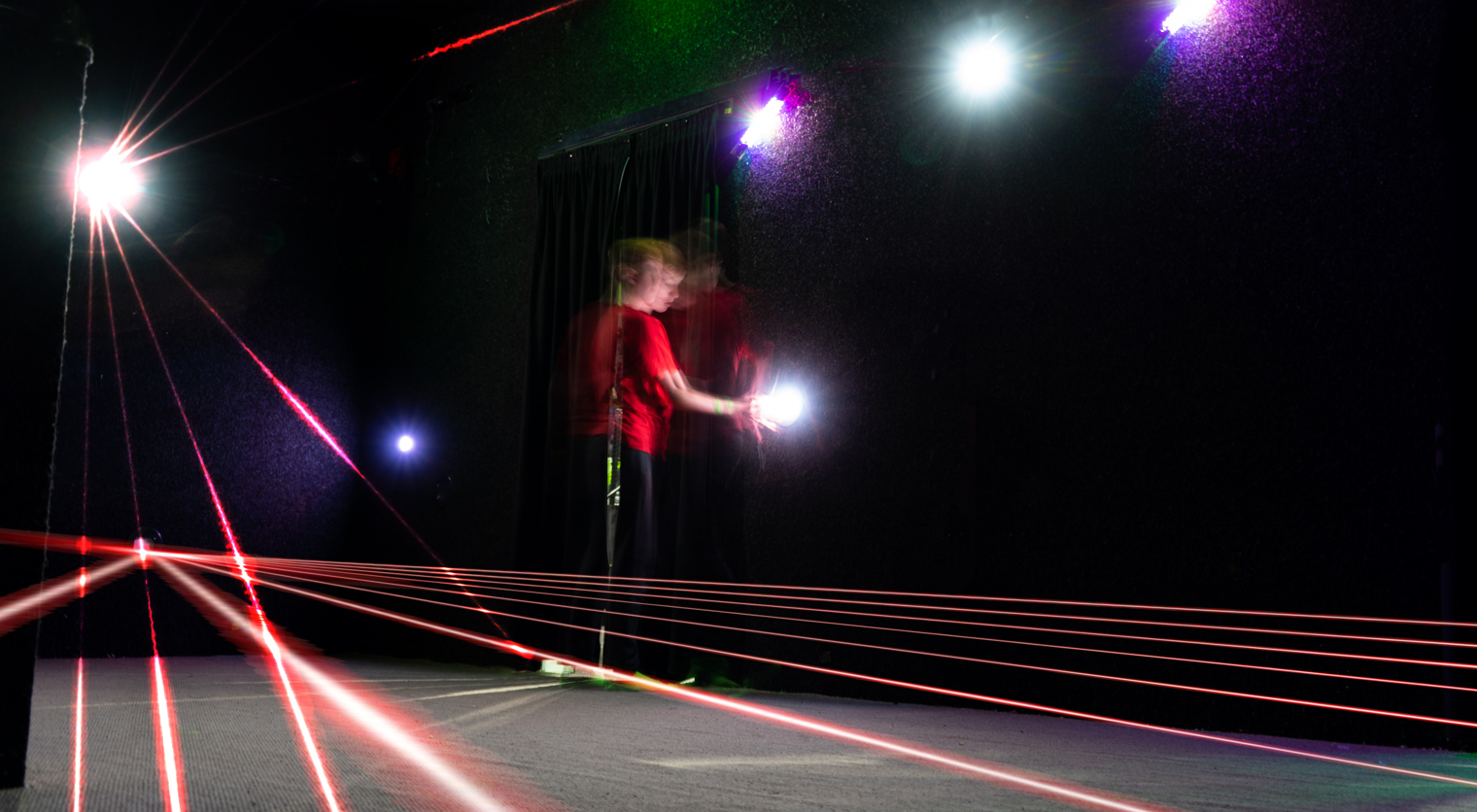 A child exploring a Laser Maze at Flip Out UK