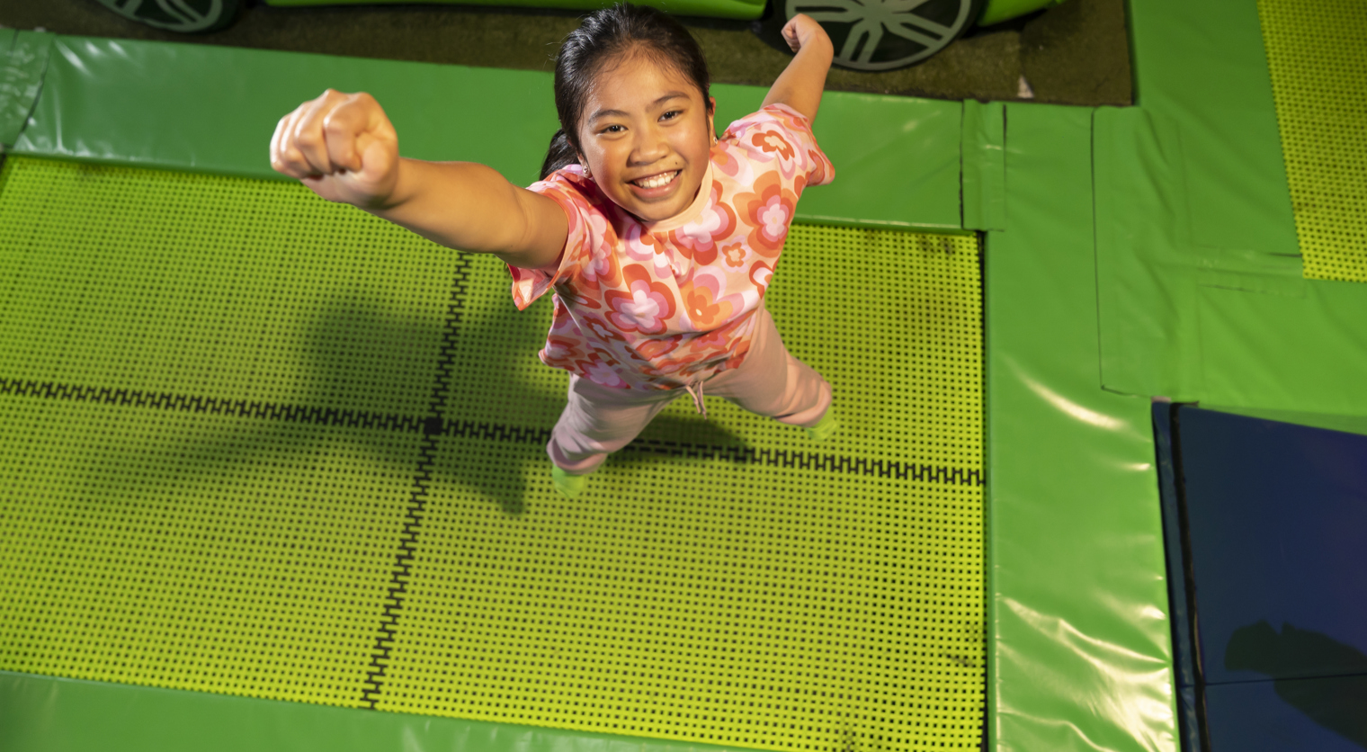 A child posing on the Trampolines at Flip Out UK