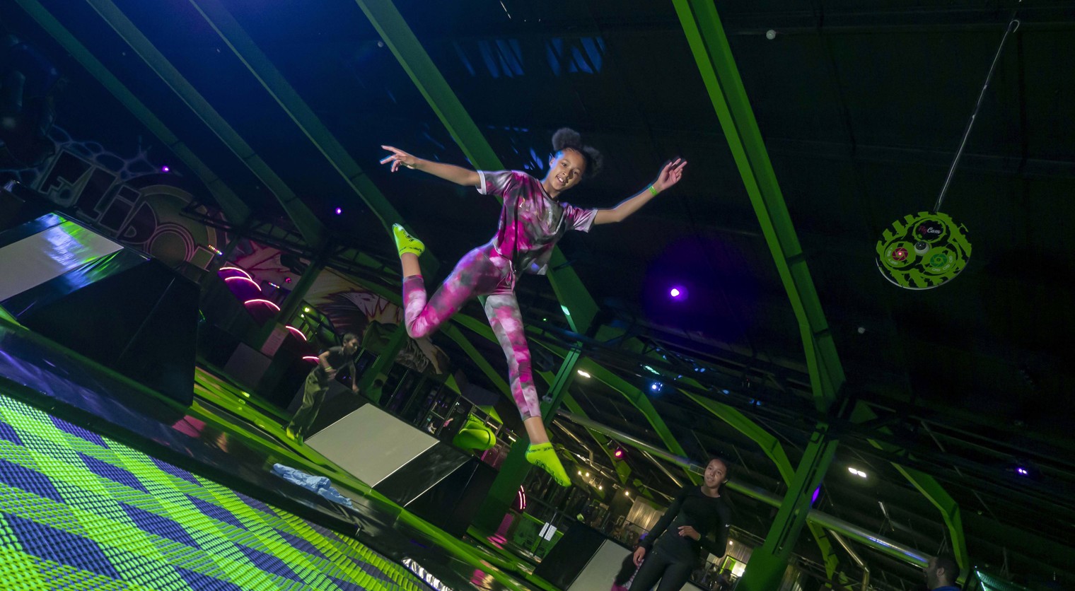 A child posing in the air on the Super Trampoline at Flip Out UK