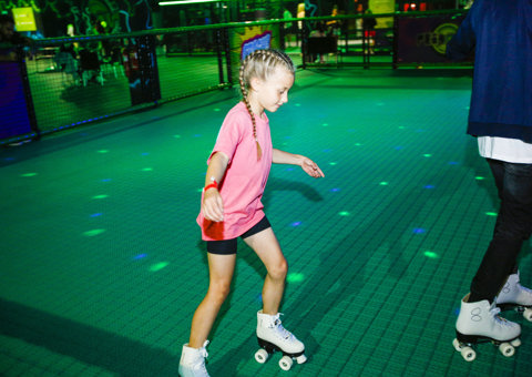A girl enjoying the Roller Rink at Flip Out UK