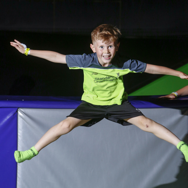 Boy jumping with joyful expression