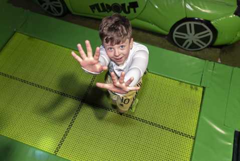 Boy bouncing on the trampolines at Flip Out Croydon